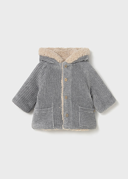 Gray knitted jacket with beige sherpa lining on a light gray background