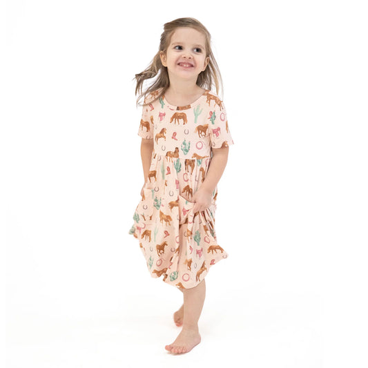 Girl wearing Western Horses Pink Short Sleeve Twirly Dress