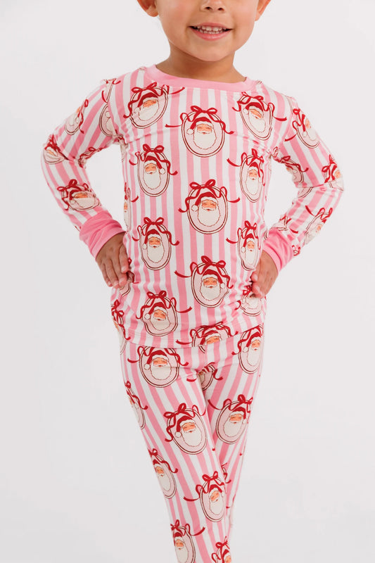 Child wearing the Pink Santa Claus Lane two piece bamboo pajama set