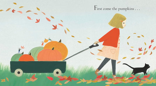 Inside spread of Wonderful Halloween by Emily Winfield Martin with a girl pulling a wagon of pumpkins and a black cat