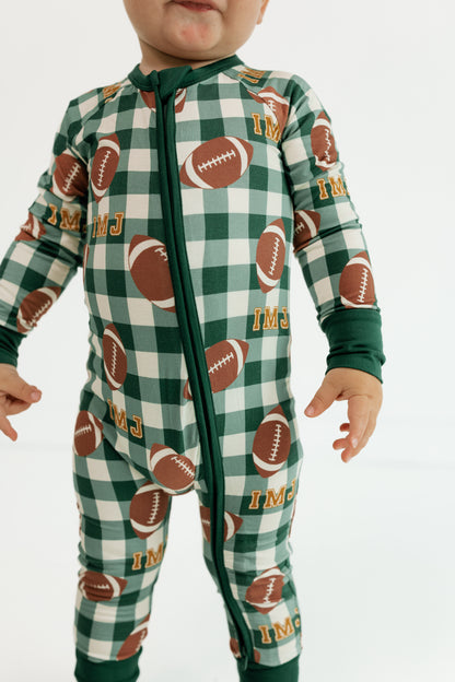 Close up of the double zipper on the Game Day Gingham bamboo romper for babies
