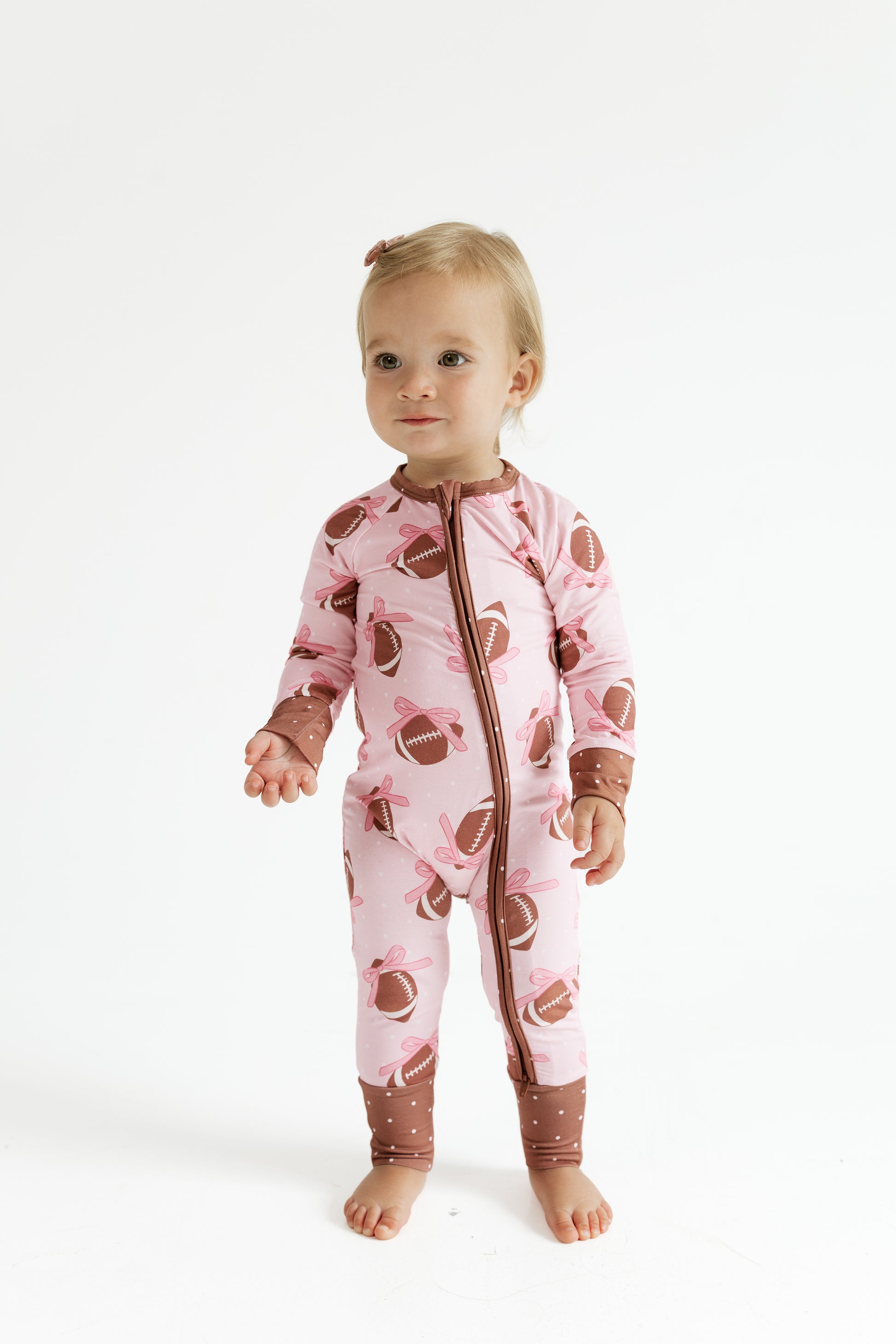 Back view of the In My Jammers Game Day Bows zipper romper for babies