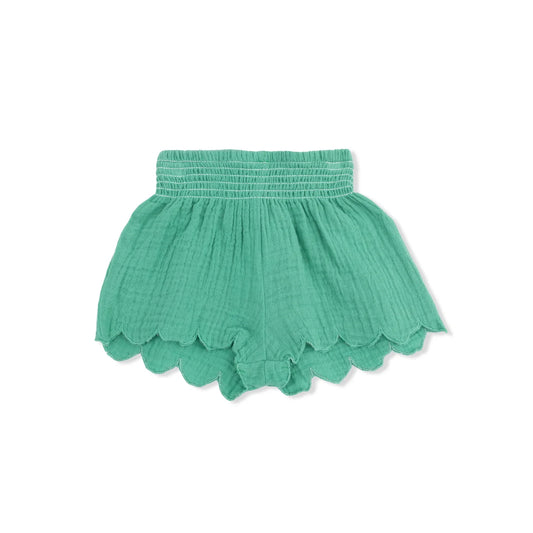 Green shorts with scalloped edge on a white background