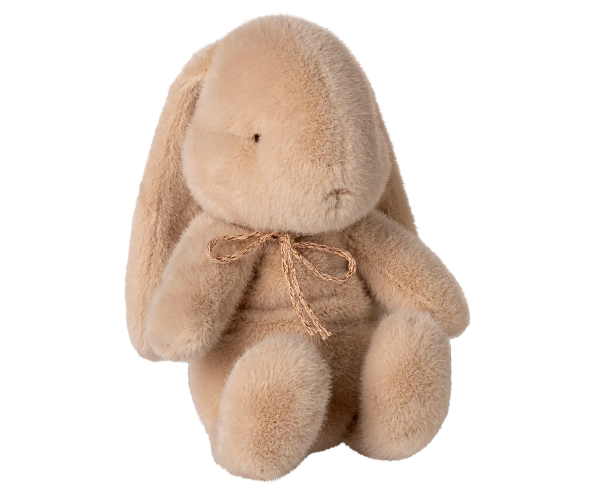 Plush bunny toy with a bow.