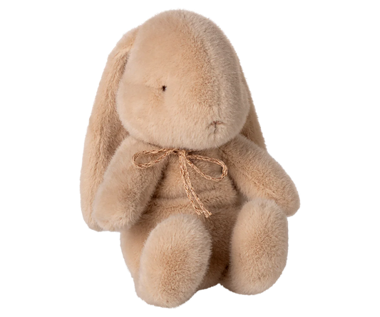 Plush bunny toy with a bow.