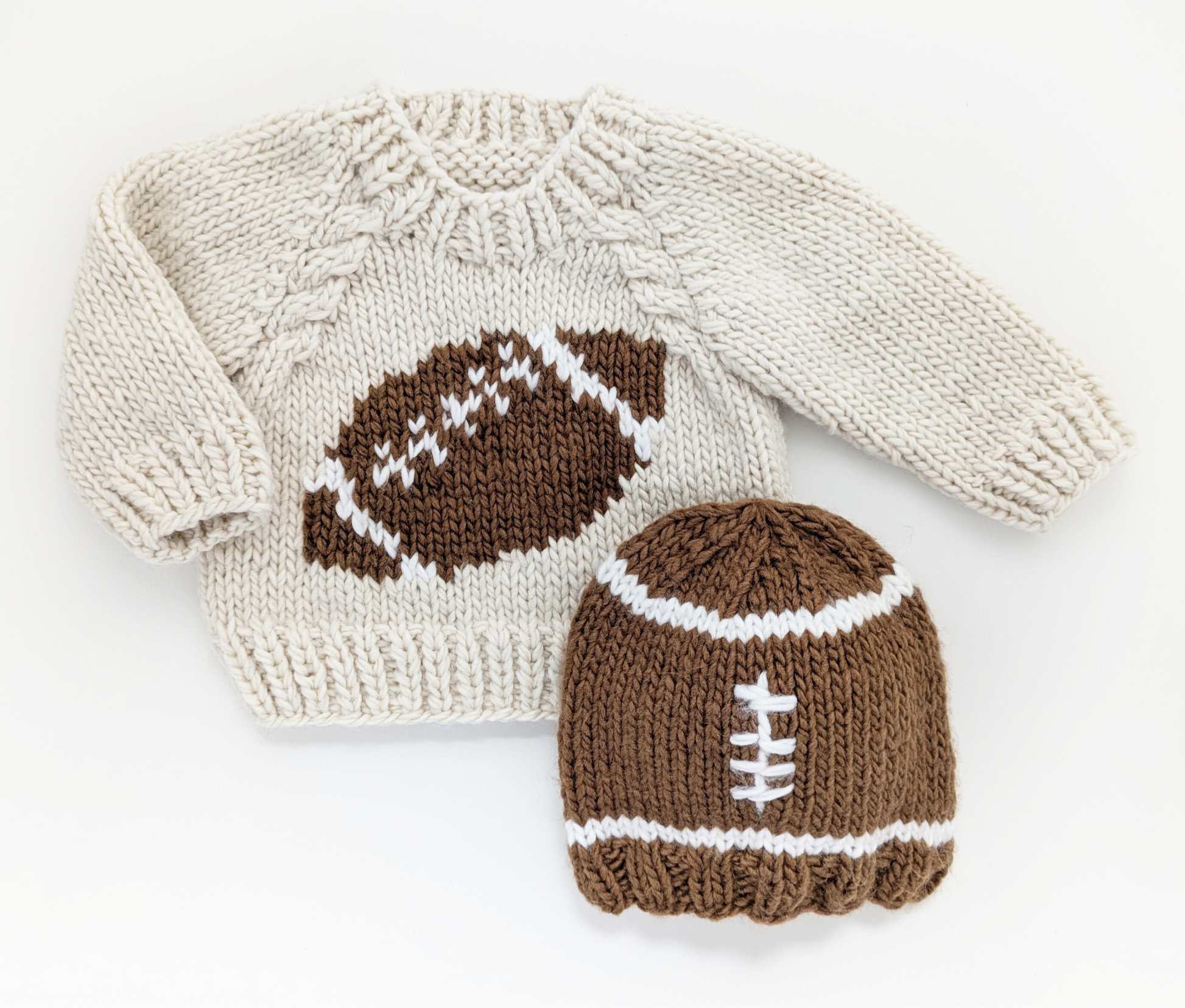 Knitted sweater and hat with football design on a white background