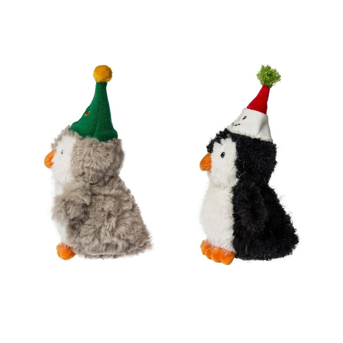 Two plush toys penguins wearing festive hats on a white background.