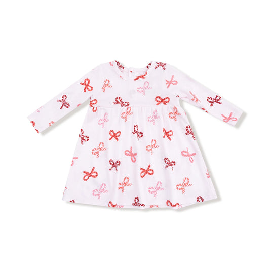 White dress with red and pink bow pattern on a white background