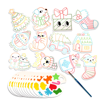 Contents of the Playful Painters Merry & Bright kit — die-cut Christmas cards, watercolour paints and a brush