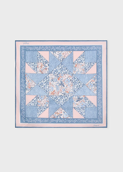 patchwork inspired bandana with floral pattern on a white background