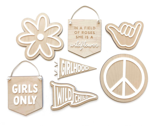 Collection of 97 Design Co. wooden signs including the Wildflower banner, daisy, peace sign and Girls Only shapes