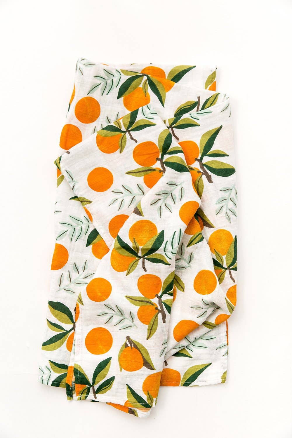 Folded up clementine swaddle. the oranges have green stems and leaves on them and are placed throughout either as a single clementine or in bunches of one or two clementines.