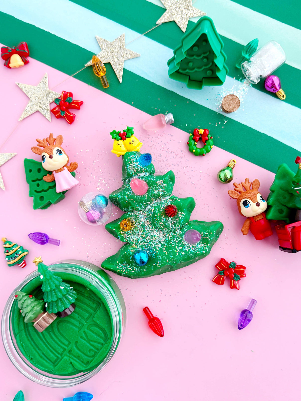 Trim a Tree KidDough play kit with a green dough tree and mini ornament pieces on pink