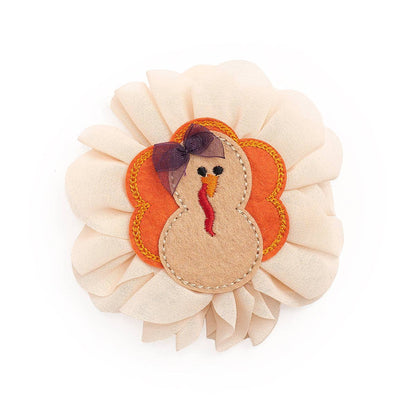 Chiffon Thanksgiving hair clip featuring multicolor turkey motif. The turkey has a small chiffon hair bow on her head. Ribbon-covered alligator clip to grip the hair. 