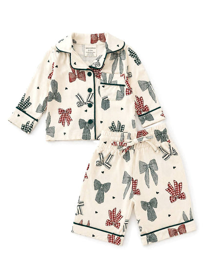 Front flat lay of the SpearmintLOVE Country Christmas Bows lounge set showing the red and green bow print