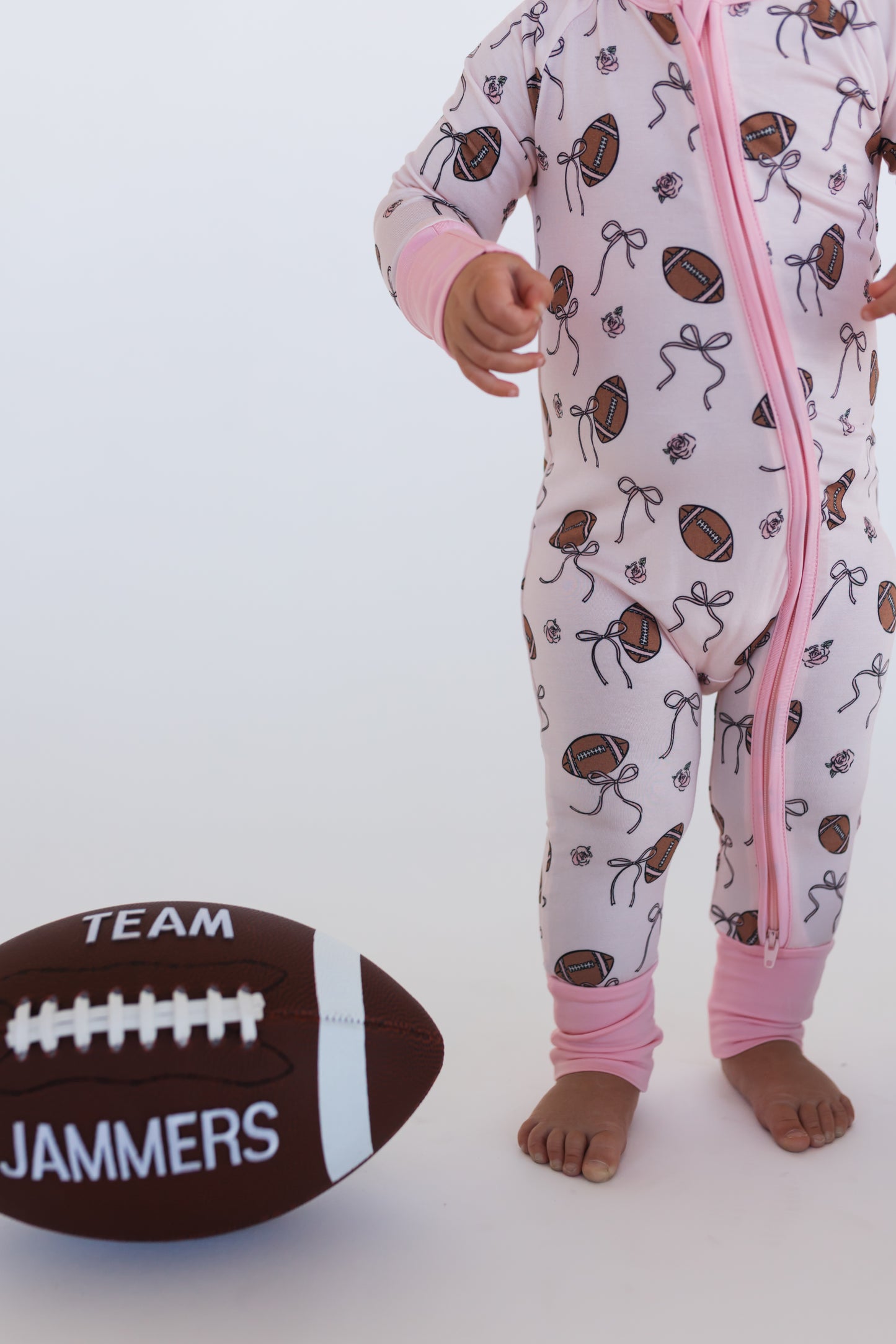 Blush Football Zipper Romper