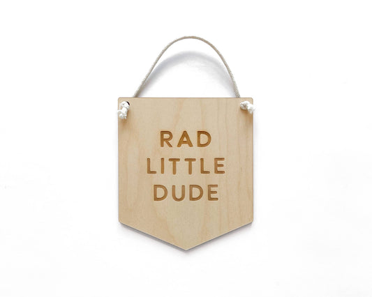 97 Design Co. Rad Little Dude wooden banner sign with hanging string on a white background