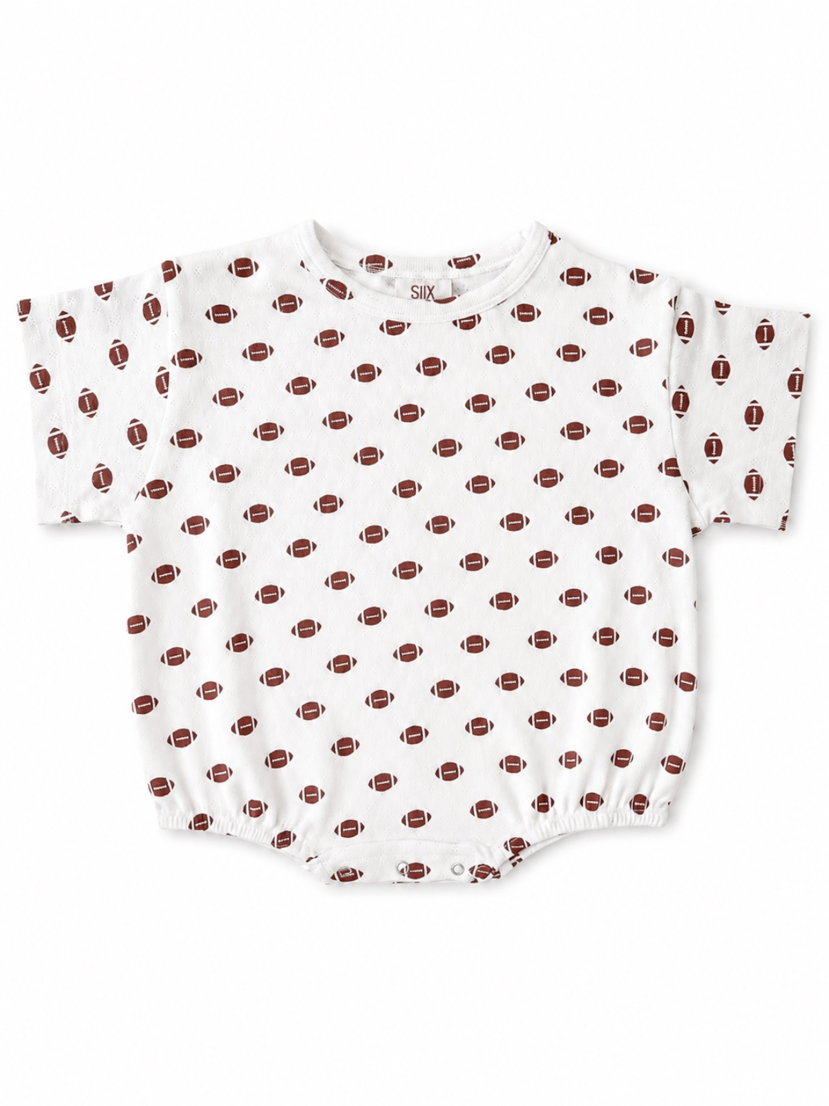 White baby romper with football pattern on a white background