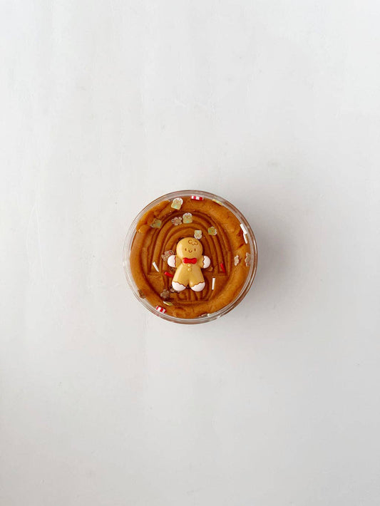Gingerbread Cookie KidDough in a 4 ounce tub with a gingerbread man shape on top