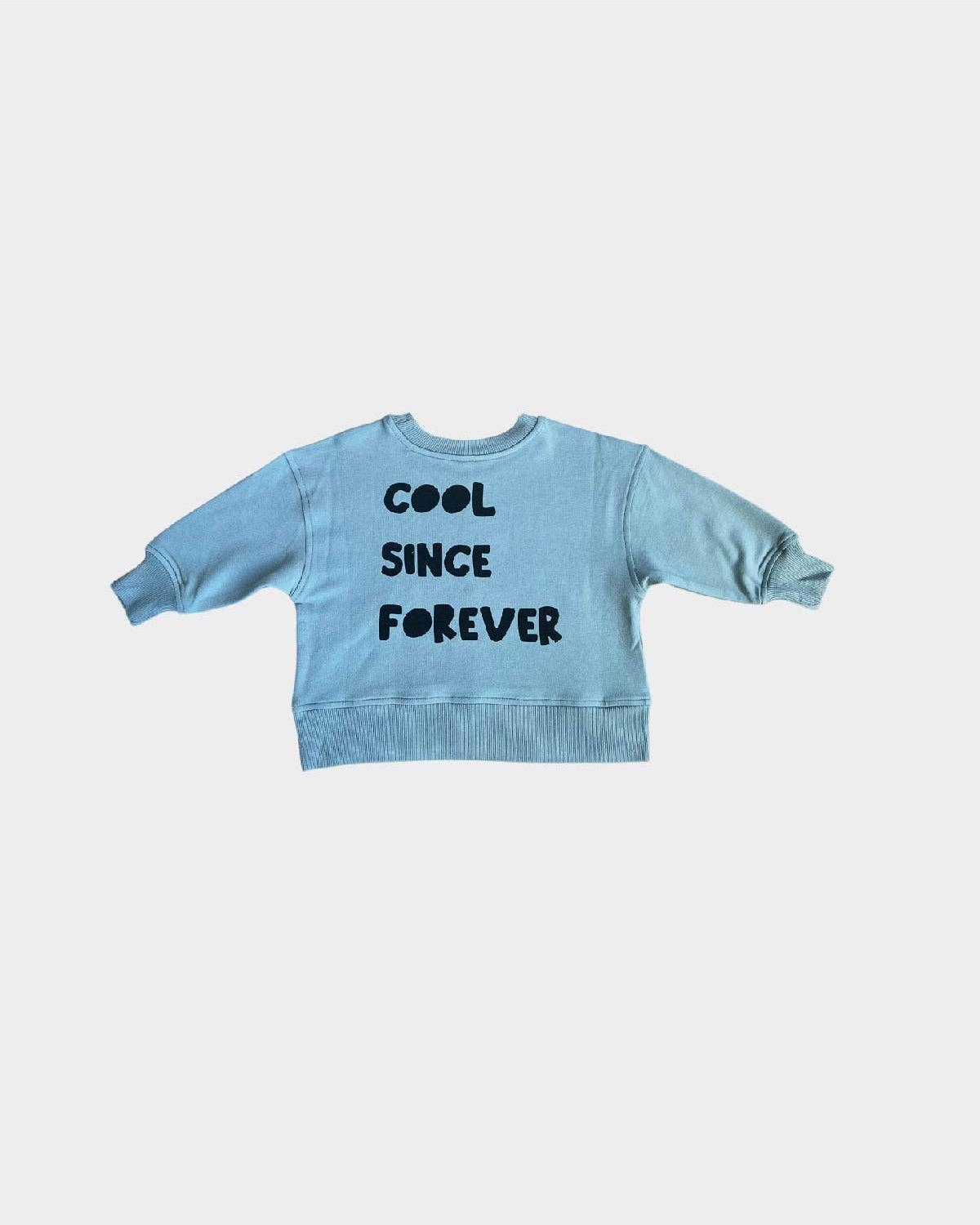 back of our cool kid boxy sweatshirt, the back says "Cool Since Forever" 