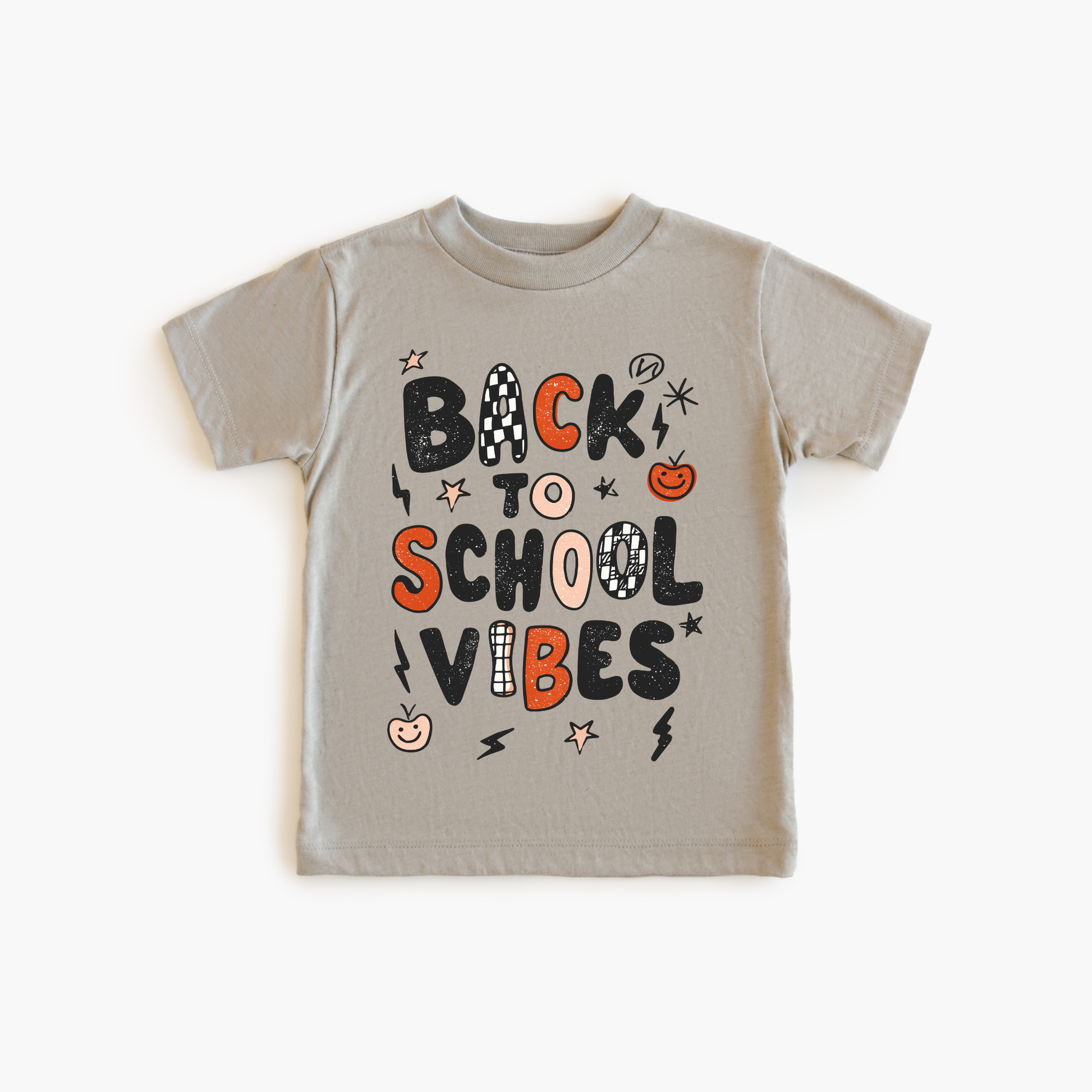 Children's t-shirt with 'Back to School Vibes' text on a beige background
