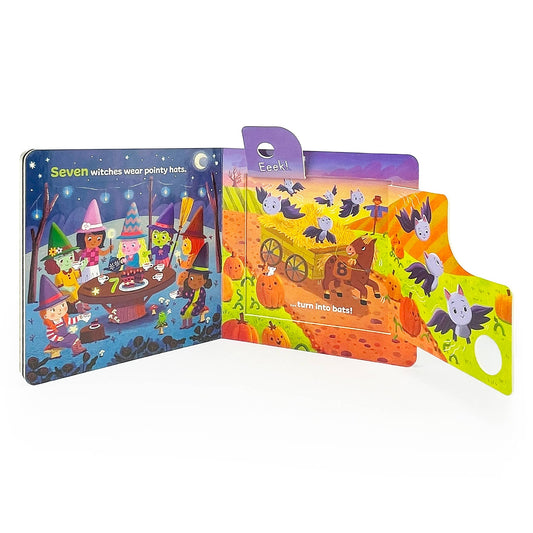 Inside spread of the Cottage Door Press One Little Pumpkin board book with a haunted house pop-up and bat flaps