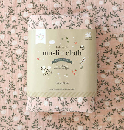 Package of 'little lovely' muslin cloth on a floral patterned background