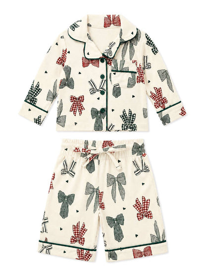 Flat lay of the SpearmintLOVE Country Christmas Bows lounge set with collared top and matching pants