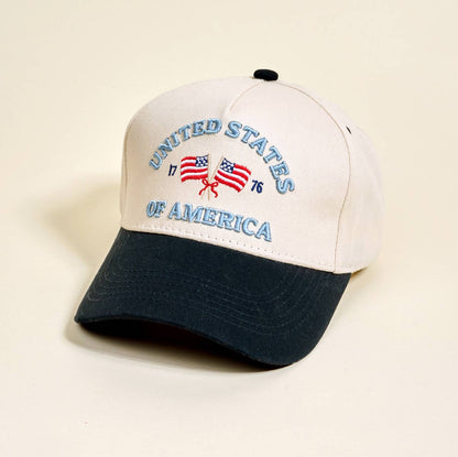 Cap with 'United States of America' text and flag design on a beige background