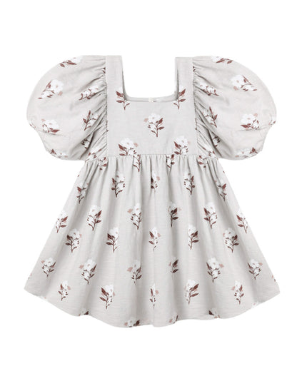 Rylee + Cru Brea Dress in the Wildflower print on soft fog grey, a girls' cotton dress with a square neckline, balloon sleeves, empire waist and full twirl skirt, laid flat