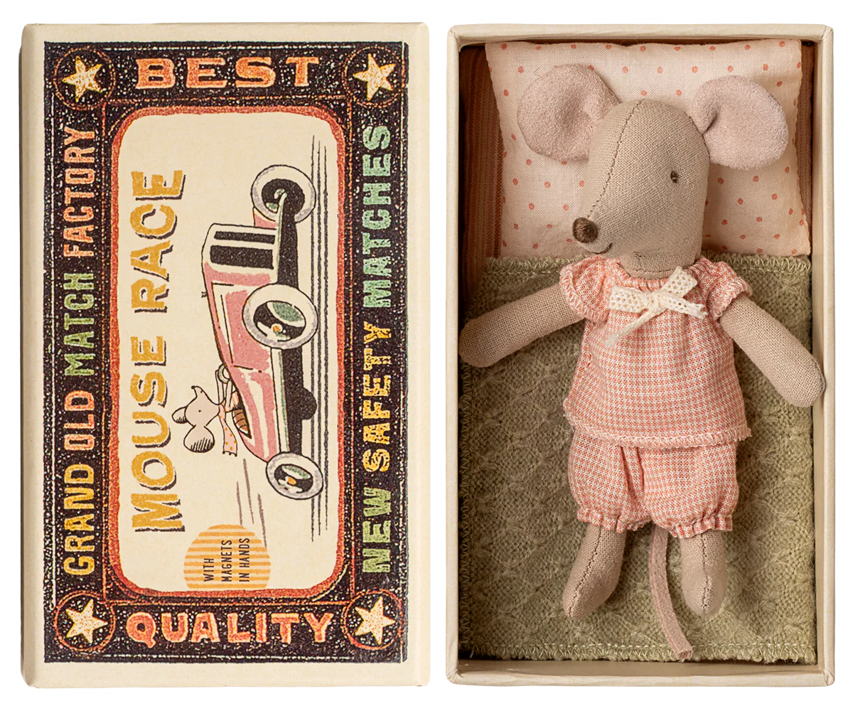 Little sister mouse wearing a pink gingham pajama set in a matchbox with a vintage-style matchbox design.