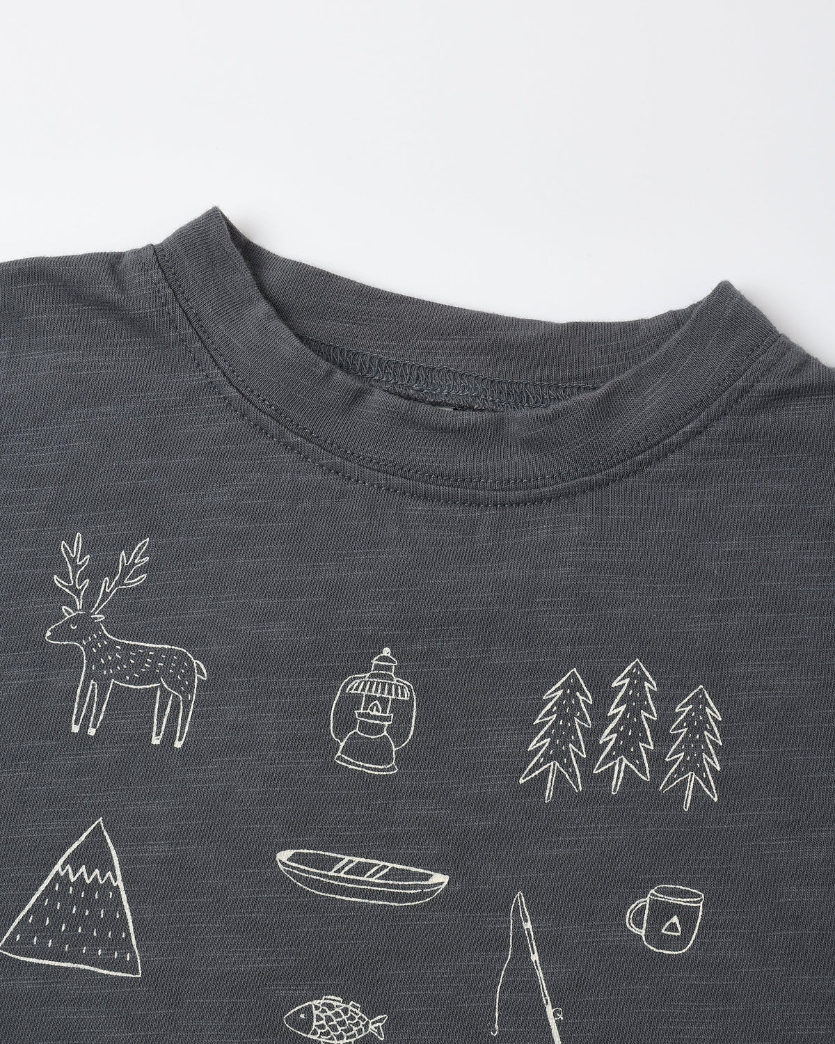 Close view of the Let's Go Camping print showing a deer, canoe, trees, mountains and a camp mug