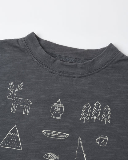 Close view of the Let's Go Camping print showing a deer, canoe, trees, mountains and a camp mug