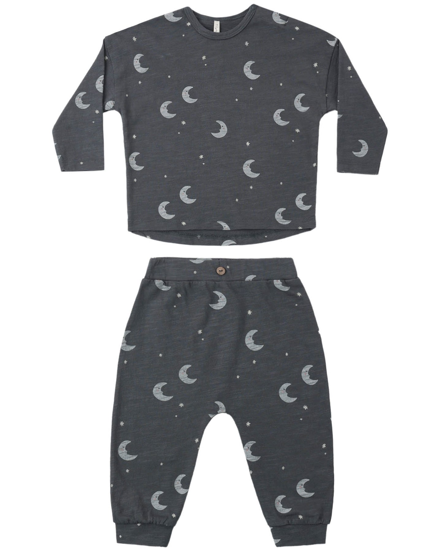Children's midnight colored pajama set with moon and star pattern on a white background
