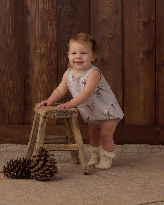 Rylee + Cru Bubble Onesie in Wildflower print on soft fog, a sleeveless baby romper in cotton jersey