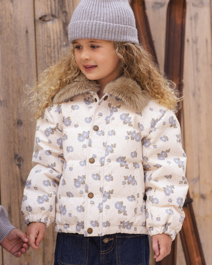 Girl in a grey beanie wearing the Rylee + Cru Idyllwild Jacket in blue floral with a faux fur collar