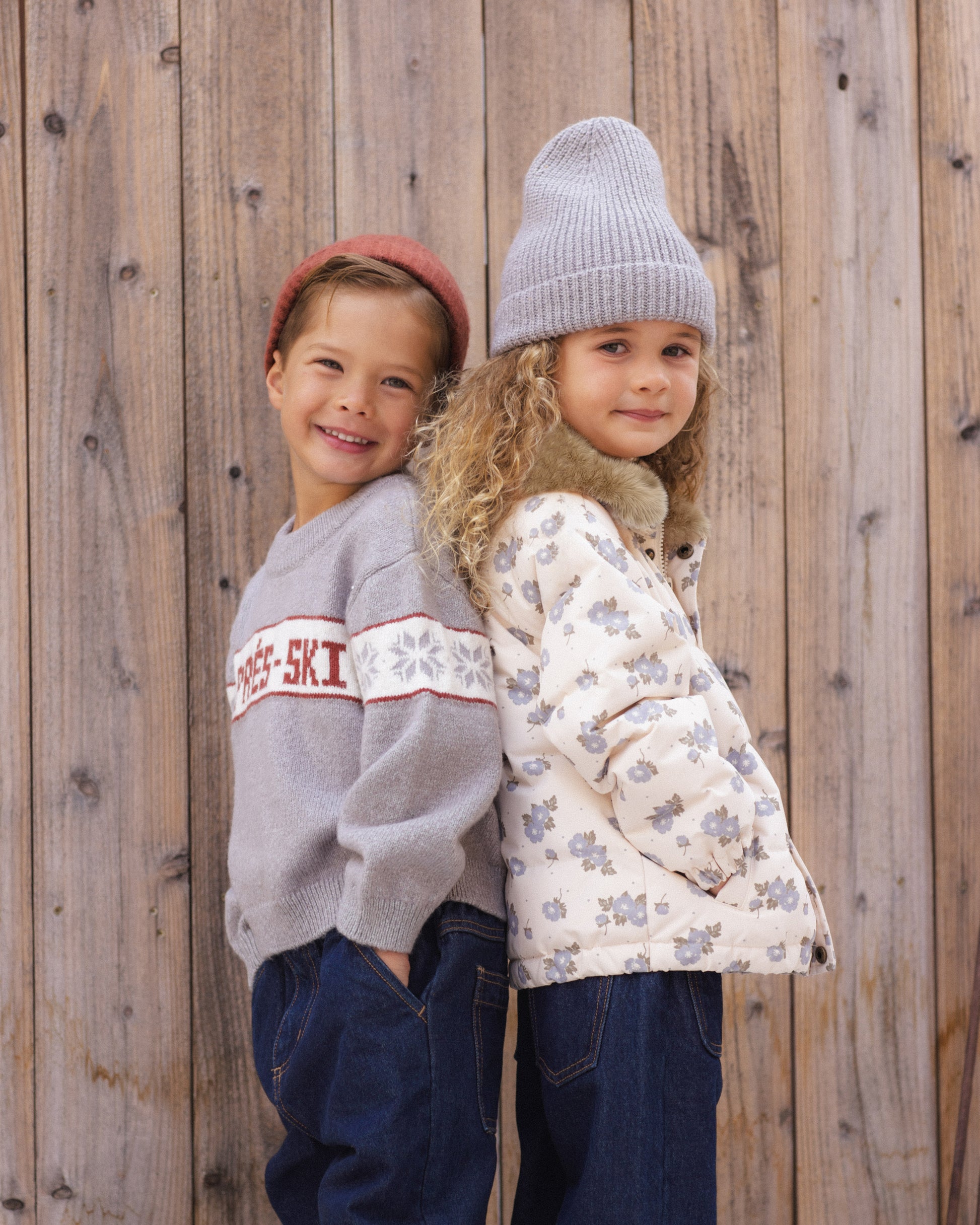 Two girls smiling together in the snow, one in the Rylee + Cru Reagan Apres Ski sweater