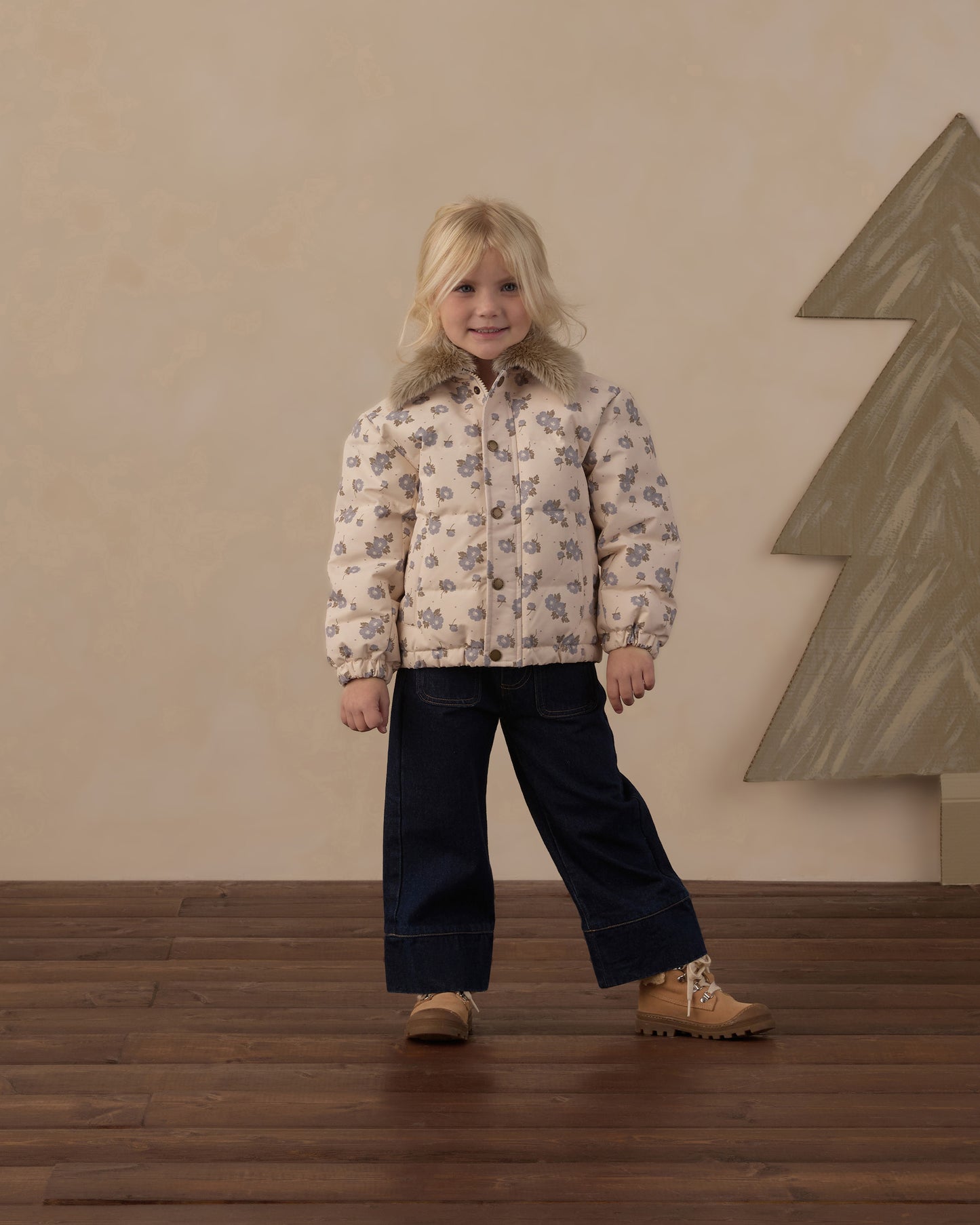 Girl standing in the Rylee + Cru Idyllwild Jacket in blue floral with dark wide leg pants