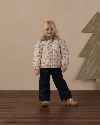 Girl standing in the Rylee + Cru Idyllwild Jacket in blue floral with dark wide leg pants
