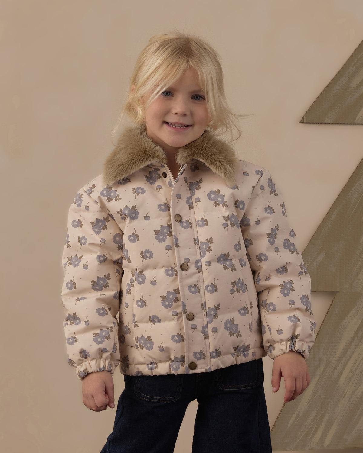 Smiling girl in the Rylee + Cru Idyllwild Jacket, closer view of the blue floral quilting
