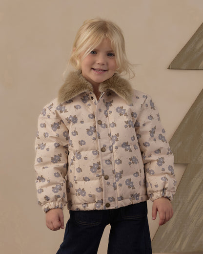 Smiling girl in the Rylee + Cru Idyllwild Jacket, closer view of the blue floral quilting