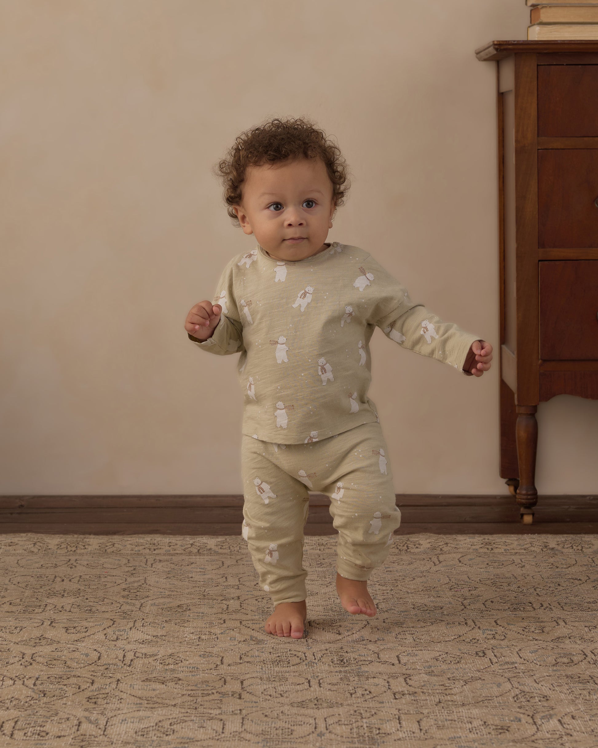 Baby standing in the Rylee + Cru Polar Bears long sleeve tee and pant set in sage