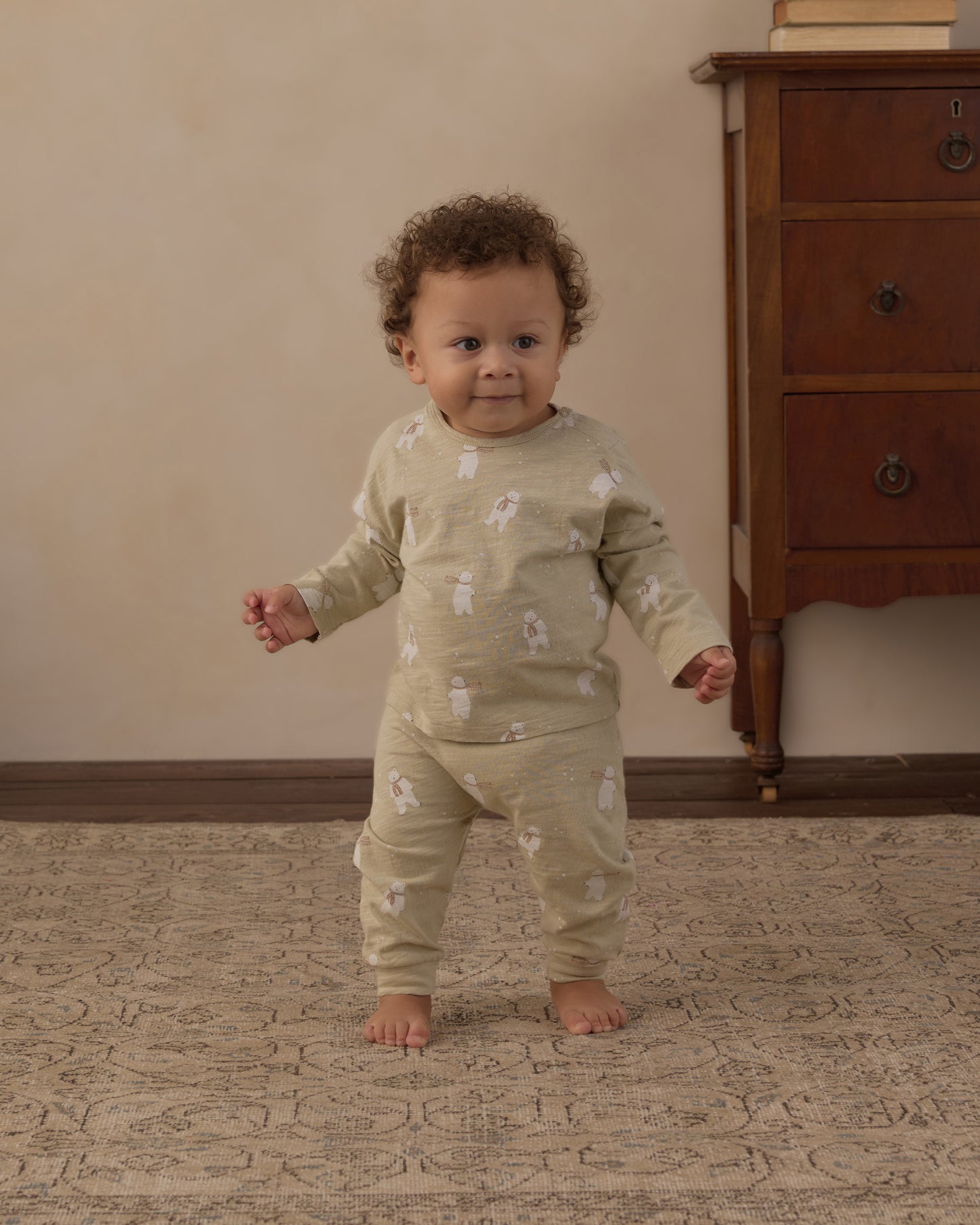 Baby walking in the Rylee + Cru long sleeve tee and pant set in the sage Polar Bears print