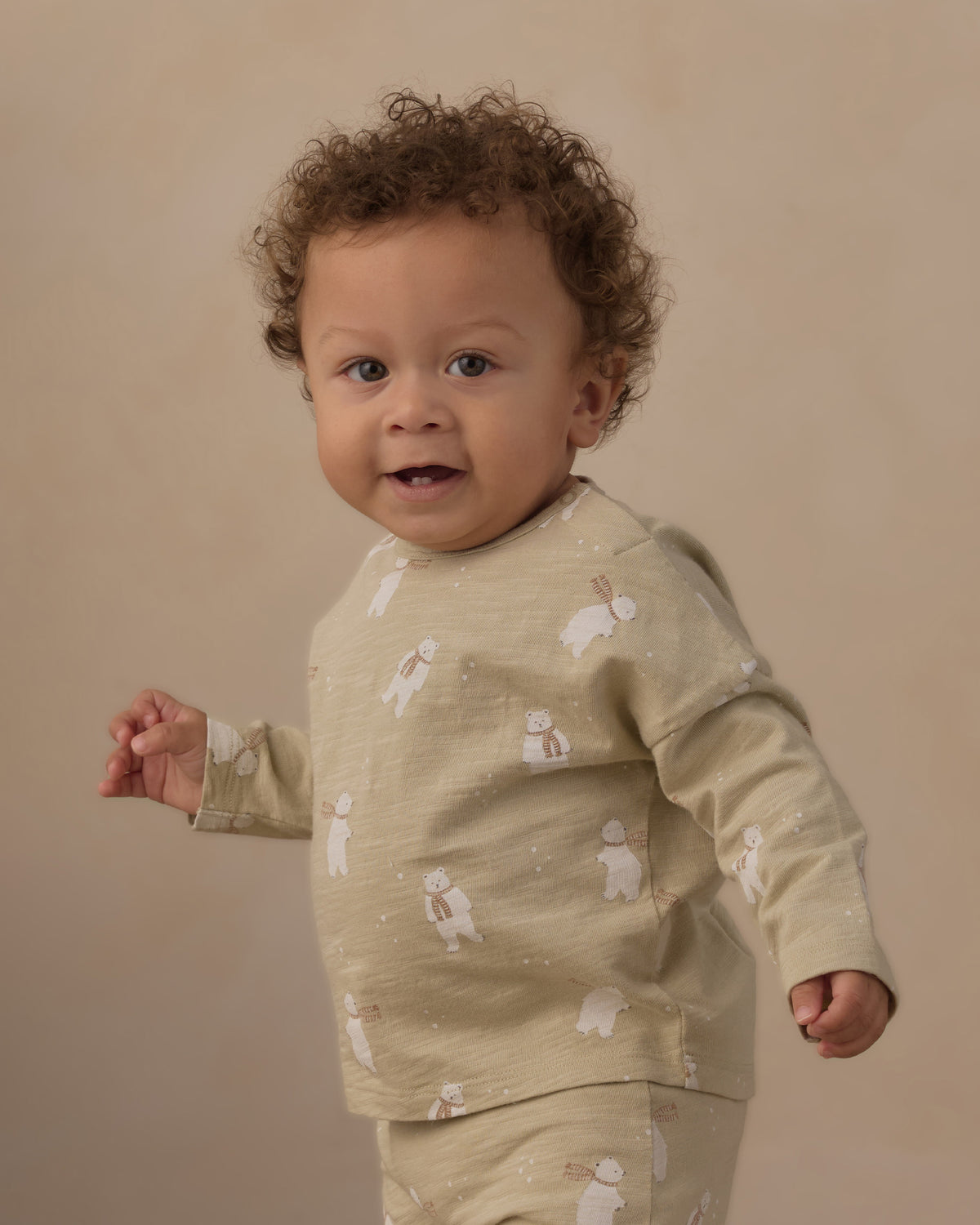 Close view of a baby in the sage Polar Bears long sleeve tee and pant set from Rylee + Cru