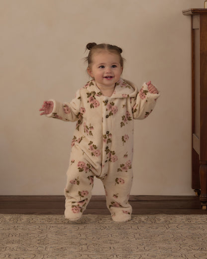 Toddler standing and smiling in the Rylee + Cru Rose Garden fleece jumpsuit