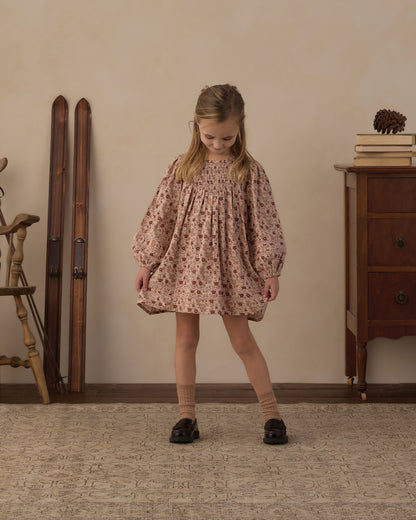Girl standing in the Rylee + Cru Selene pink floral dress with black shoes