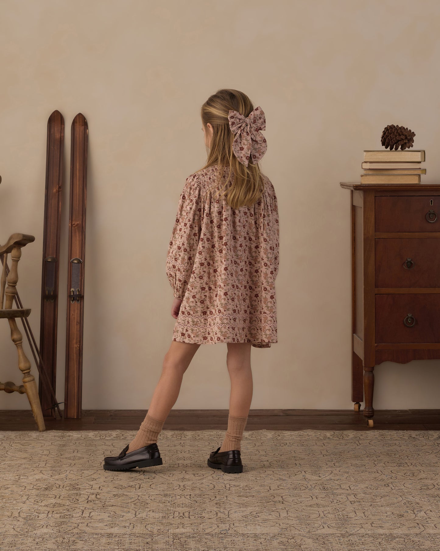 Side view of a girl wearing the Rylee + Cru Selene pink floral dress