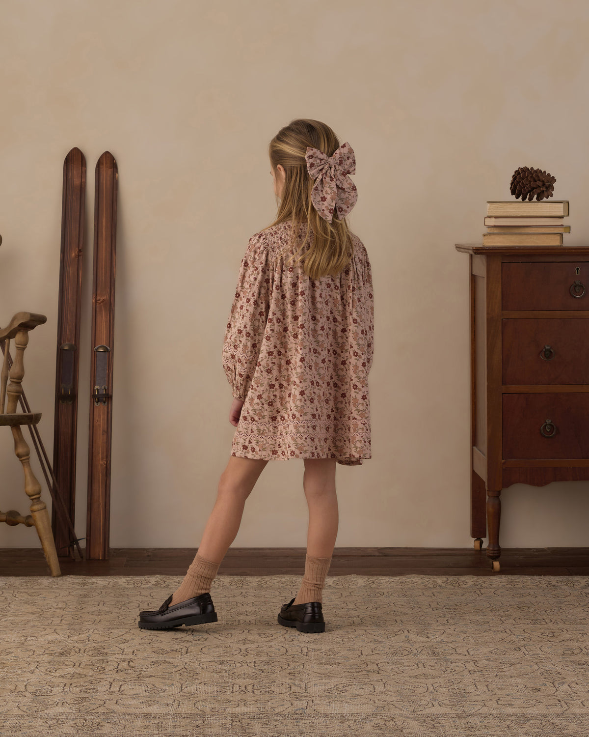 Side view of a girl wearing the Rylee + Cru Selene pink floral dress