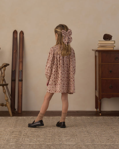 Side view of a girl wearing the Rylee + Cru Selene pink floral dress