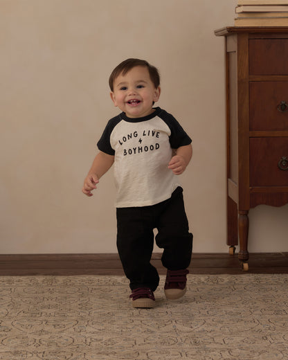 Toddler walking and smiling in the Rylee + Cru Long Live Boyhood raglan tee